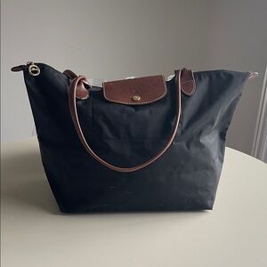 Longchamp Elegant Black Tote with Brown Trim